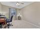 Neutral bedroom offering great natural light, a ceiling fan and a comfortable carpet at 1655 Hermosa Dr, Highlands Ranch, CO 80126