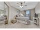 Neutral bedroom with a closet, window, carpeting, ceiling fan, and light-brown painted walls at 1655 Hermosa Dr, Highlands Ranch, CO 80126