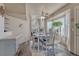 Dining room with natural light from a bay window and modern ceiling fan at 1655 Hermosa Dr, Highlands Ranch, CO 80126