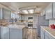 Traditional kitchen with shaker style cabinets, stainless appliances, and plank flooring at 1655 Hermosa Dr, Highlands Ranch, CO 80126