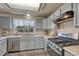 Functional kitchen with light-colored cabinets, modern appliances, and ample counter space at 1655 Hermosa Dr, Highlands Ranch, CO 80126