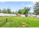 Large backyard with shed, manicured lawn, and secure fencing provides ample space for outdoor activities at 2112 S Olathe St, Aurora, CO 80013