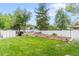 The backyard has a storage shed, garden and a white fence at 2112 S Olathe St, Aurora, CO 80013