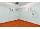 Bedroom with a fan, carpet floor, and natural light from the two windows at 2112 S Olathe St, Aurora, CO 80013