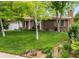 Charming brick home with a well-manicured lawn and mature trees at 2112 S Olathe St, Aurora, CO 80013