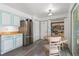 Open kitchen with stainless appliances, breakfast nook and pantry at 2112 S Olathe St, Aurora, CO 80013
