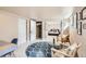 Finished basement living area with plush carpet, a walk-in closet, and stylish furnishings at 579 S Sherman St, Denver, CO 80209