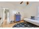 Cozy bedroom with a modern dresser, hardwood floors, and ample natural light at 579 S Sherman St, Denver, CO 80209
