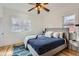 Bright bedroom includes a comfortable bed, ample windows, and a ceiling fan at 579 S Sherman St, Denver, CO 80209