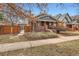 Brick home with fenced yard and mature landscaping at 579 S Sherman St, Denver, CO 80209