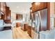Charming kitchen features stainless steel appliances and wood cabinetry at 579 S Sherman St, Denver, CO 80209