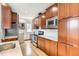 Classic kitchen boasts stainless steel appliances, wood cabinets, and a subway tile backsplash at 579 S Sherman St, Denver, CO 80209