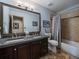 Bathroom featuring double sinks, and a shower and tub combo at 31518 Niakwa Rd, Evergreen, CO 80439