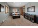 Bedroom featuring natural light, wood trim and carpet at 31518 Niakwa Rd, Evergreen, CO 80439