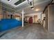Garage with covered car, work bench, cabinets and tools at 31518 Niakwa Rd, Evergreen, CO 80439