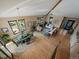 Spacious living room and dining area with hardwood floors, lots of windows, and an open floor plan at 31518 Niakwa Rd, Evergreen, CO 80439