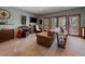 Open living room with large windows and balcony access at 31518 Niakwa Rd, Evergreen, CO 80439