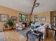 Spacious living room with a large window, hardwood floors, and comfortable seating at 31518 Niakwa Rd, Evergreen, CO 80439