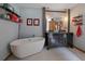 Luxurious bathroom boasting double sinks, modern vanity, and a freestanding bathtub at 31518 Niakwa Rd, Evergreen, CO 80439
