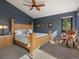 Inviting bedroom featuring a king-sized bed, natural light, and vaulted ceiling at 31518 Niakwa Rd, Evergreen, CO 80439