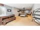 Spacious basement rec room setup with a ping pong table, seating, and a projector screen at 10397 Helsinki St, Parker, CO 80134
