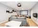 Finished basement with a cozy entertainment area and a large projector screen at 10397 Helsinki St, Parker, CO 80134