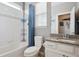 Clean bathroom with a shower, bathtub and a sink with granite countertop at 10397 Helsinki St, Parker, CO 80134