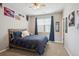 Comfortable bedroom with a wooden bed frame and blue accents, a cozy retreat at 10397 Helsinki St, Parker, CO 80134