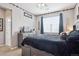Cozy bedroom with sports decor and a large window for plenty of natural light at 10397 Helsinki St, Parker, CO 80134