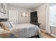 Cozy bedroom featuring plush bedding, a dark wood dresser with television and neutral paint at 10397 Helsinki St, Parker, CO 80134