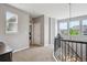 Bright upstairs hallway with neutral decor and natural light from windows at 10397 Helsinki St, Parker, CO 80134