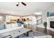 Open-concept living space with a view of the modern kitchen and a comfortable sitting area at 10397 Helsinki St, Parker, CO 80134