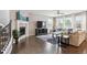Spacious living room with fireplace, hardwood floors, large windows and modern furniture at 10397 Helsinki St, Parker, CO 80134