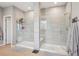 Modern bathroom with separate glass-enclosed showers, sleek tile work, and contemporary fixtures for a clean design at 10397 Helsinki St, Parker, CO 80134