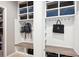 Well-organized mudroom features individual cubbies, seating, and storage solutions at 10397 Helsinki St, Parker, CO 80134