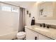 Main bathroom with granite vanity and updated fixtures at 10491 Tiger Run, Lone Tree, CO 80124