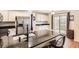 Kitchen with white cabinets, granite countertops, and stainless steel appliances at 10491 Tiger Run, Lone Tree, CO 80124