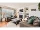 Living room with fireplace and comfortable seating area at 10491 Tiger Run, Lone Tree, CO 80124