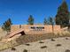 Community entrance sign for Red Rocks Ranch at 15624 W Floyd Dr, Morrison, CO 80465