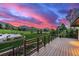 Expansive back deck with mountain views and manicured lawn, perfect for outdoor living at 5727 Colorow Dr, Morrison, CO 80465