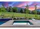 Beautifully landscaped backyard featuring a pool, hot tub, and scenic views at 5727 Colorow Dr, Morrison, CO 80465