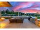 Backyard offers a built-in grill, an outdoor seating area, a pool, and picturesque mountain views at 5727 Colorow Dr, Morrison, CO 80465