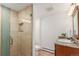 Compact bathroom with stone-look tiles in the shower, plus updated vanity and fixtures at 5727 Colorow Dr, Morrison, CO 80465