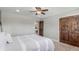 Cozy bedroom with plush carpeting, ceiling fan, and gray walls, plus views to another room at 5727 Colorow Dr, Morrison, CO 80465