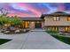 Warm and inviting home exterior with a charming front door, manicured landscaping, and elegant curb appeal at 5727 Colorow Dr, Morrison, CO 80465