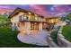 Stunning two-story home with stone accents, an expansive deck, and a walk-out basement at 5727 Colorow Dr, Morrison, CO 80465