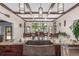 Gourmet kitchen with stainless steel appliances, custom cabinets, granite countertops, and a large island at 5727 Colorow Dr, Morrison, CO 80465