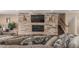 The living room has a stone fireplace and modern tv at 5727 Colorow Dr, Morrison, CO 80465