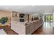 Bright living room featuring a stone fireplace, large sofa and multiple windows at 5727 Colorow Dr, Morrison, CO 80465
