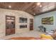 Cozy living room with a stone accent wall with fireplace and built-in wooden bookshelves at 5727 Colorow Dr, Morrison, CO 80465